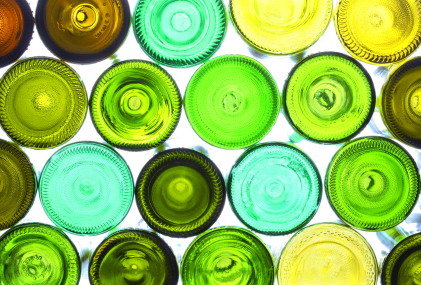 variety of empty wine bottles backlited